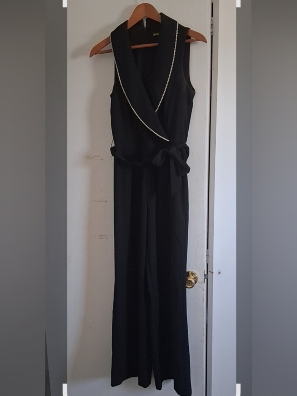 Sleeveless Black Wide-Leg Jumpsuit with Contrast Trim and Self Tie